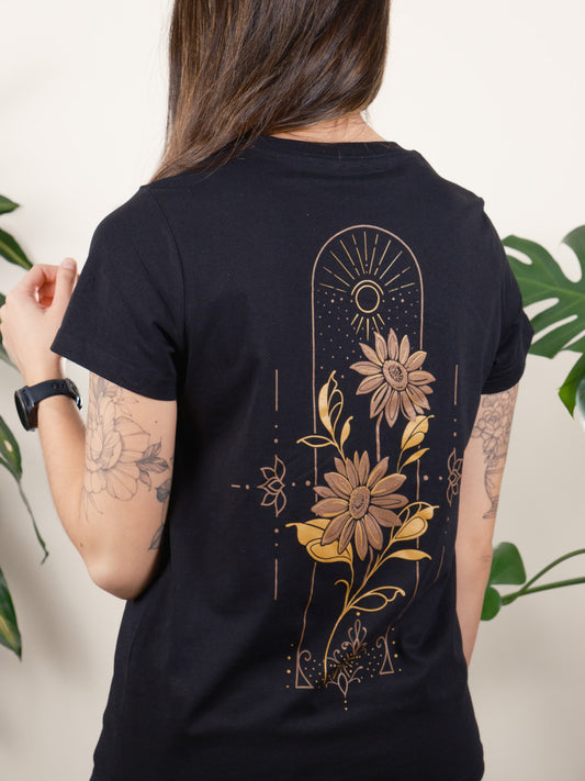 Back of T-shirt Featuring Golden Sunflowers Encased in a Geometric and Dot-work Frame. Female Model