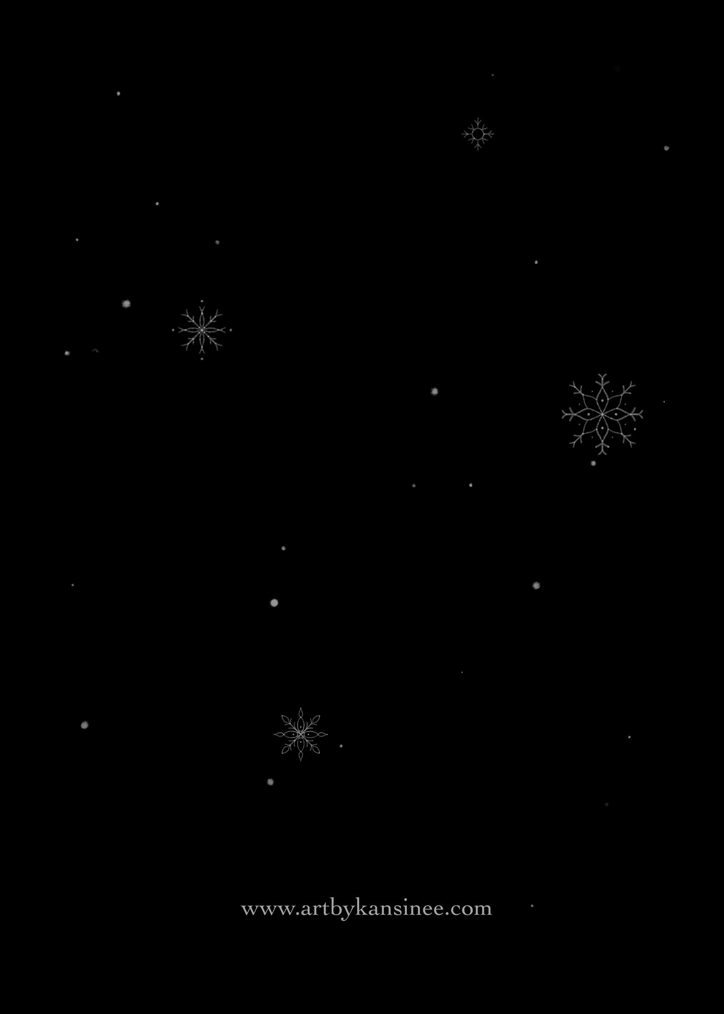 Snowflakes falling on a night sky. The back of the card