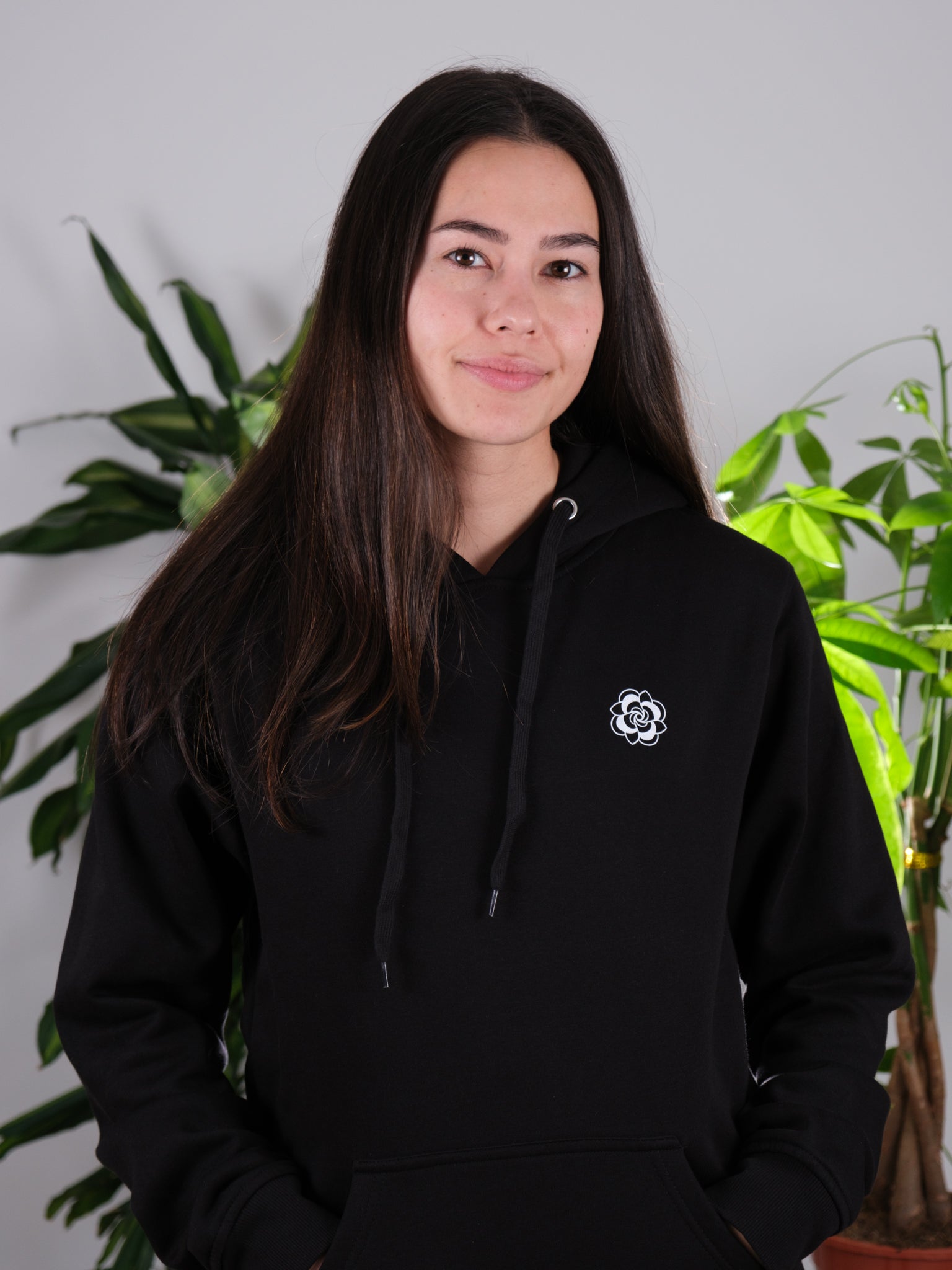 Female model front view of Love Knows No Bounds hoodie, emphasizing comfort and tattoo-inspired design.