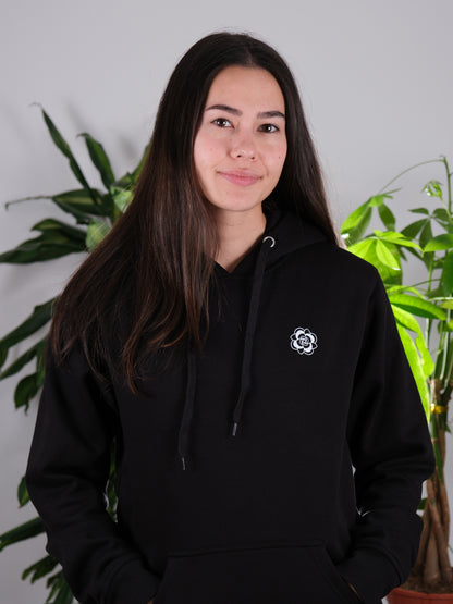 Female model front view of Let Your Mind Grow hoodie, highlighting nature-inspired design and soft fabric.