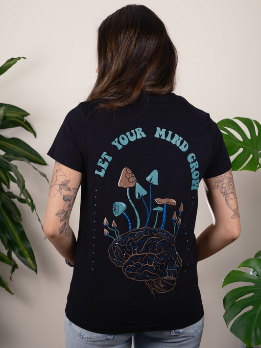 A T-shirt Design Featuring Mushrooms Growing From a Human Brain Titled "Let Your Mind Grow." Back of Shirt