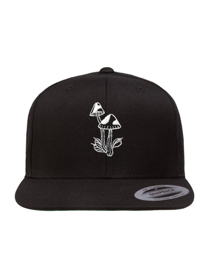 Black snapback hat with two tattoo-inspired psychedelic mushrooms and small leaves
