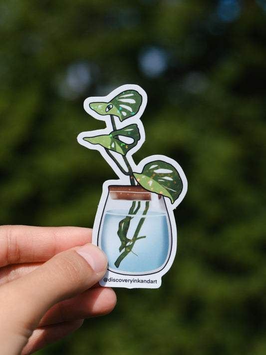 Monstera Sticker Art: A monstera being propagated in a glass