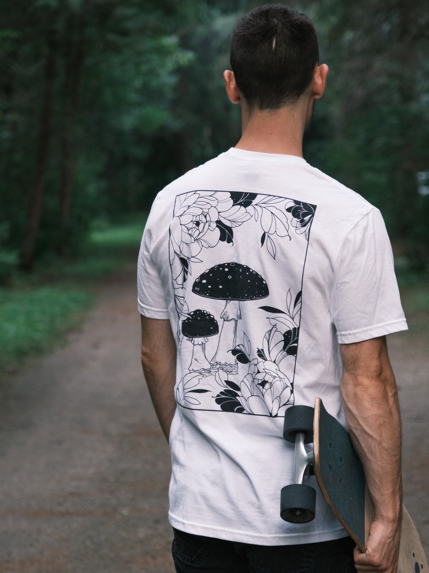 Amanita Muscaria Mushroom surrounded by tattoo-inspired florals on a white tee