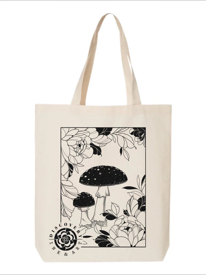 Amanita Muscaria Mushroom surrounded by tattoo-inspired florals on a beige tote bag