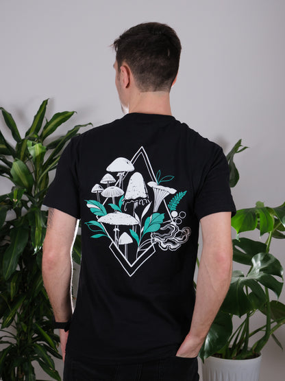 Back view of the Fragrance of Fall Tee on a male model, featuring tattoo-inspired geometric mushroom art.