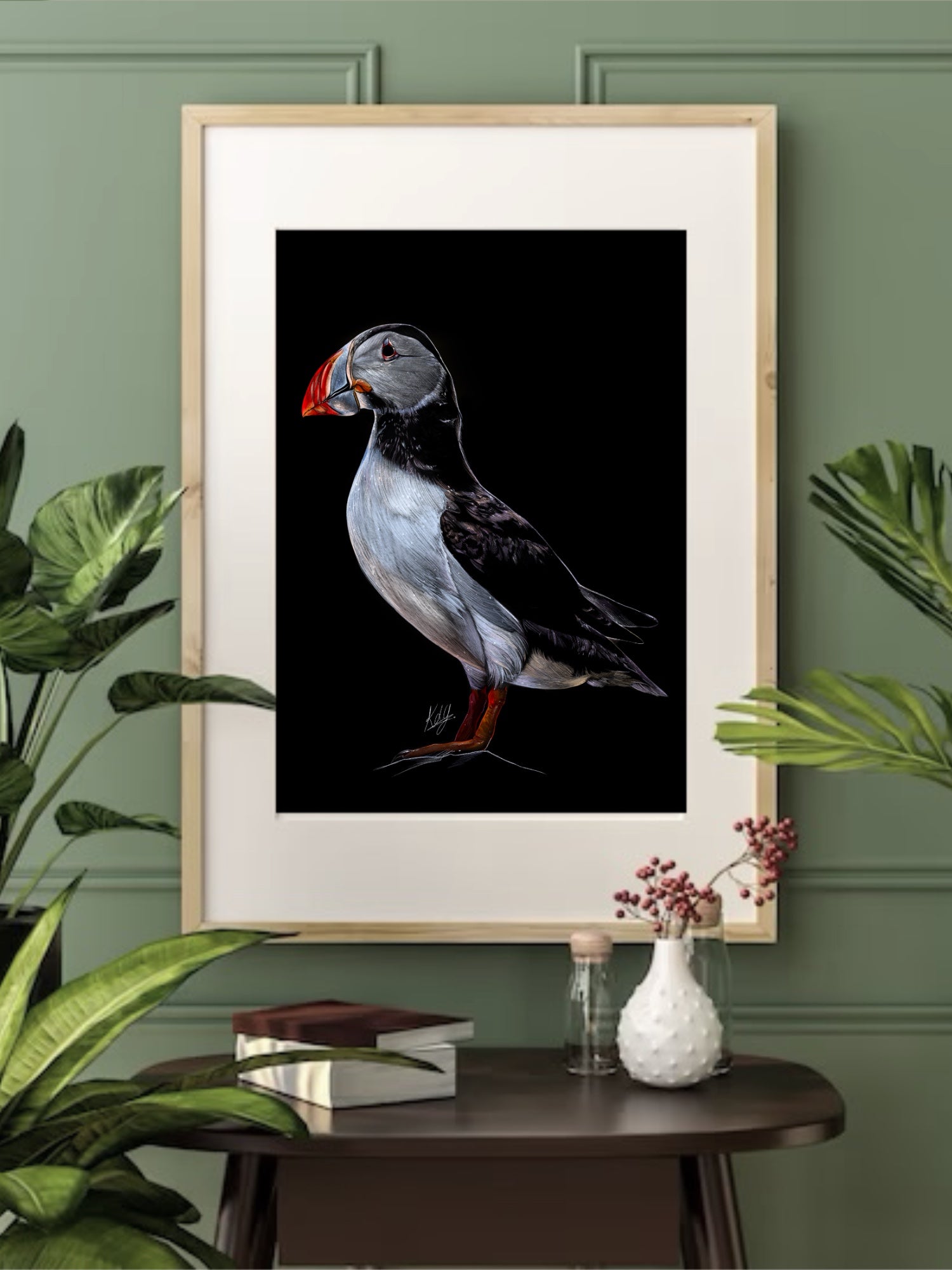 Framed Free Spirited Puffin Art Print displayed in a living space, emphasizing its nature-inspired design and artistic appeal in home decor