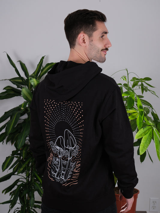Back view of the Transcendent Love Hoodie on a male model, featuring a detailed psychedelic mushroom and Pacific Beach design.