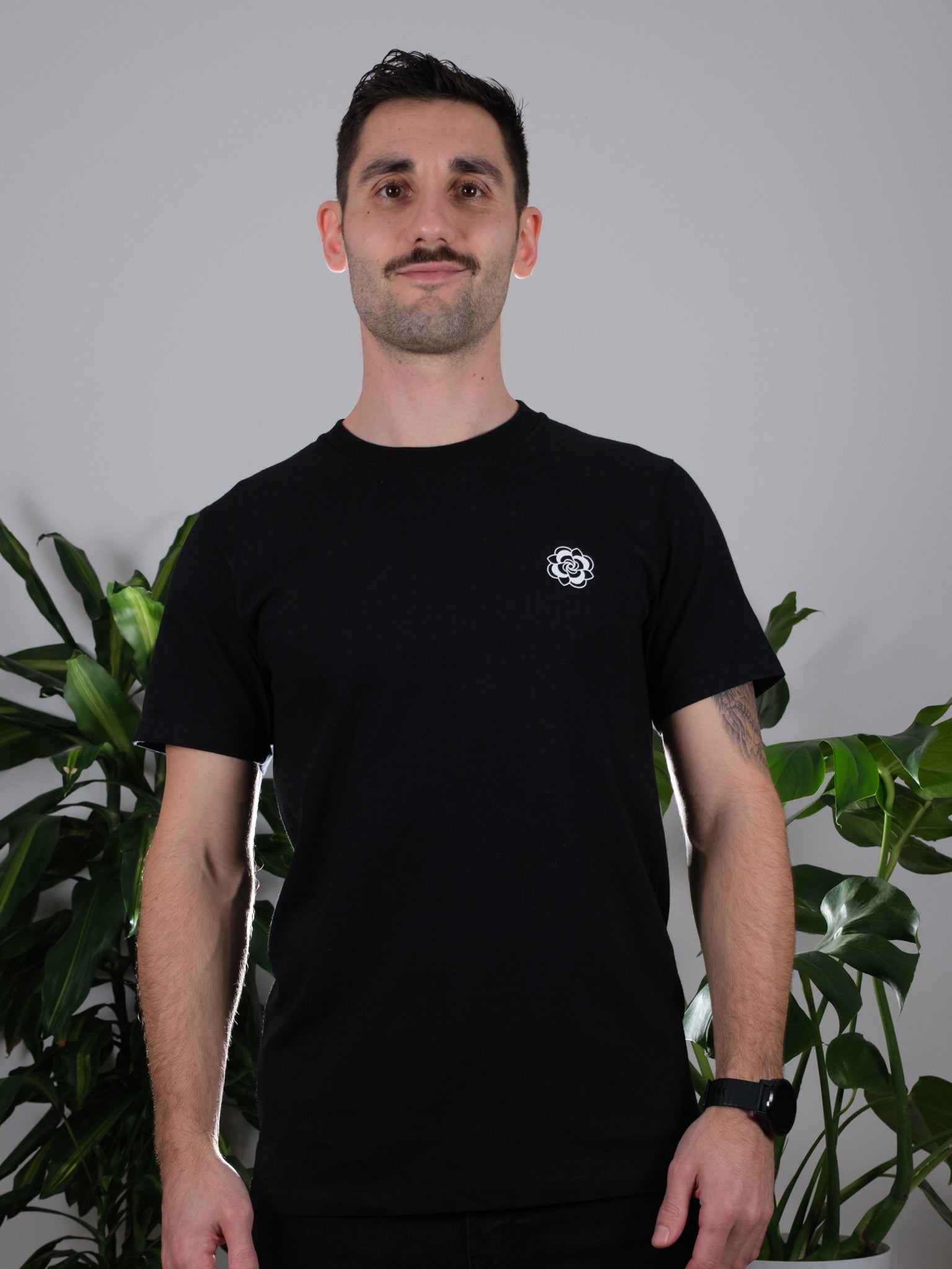 Front view of the Transcendent Love Tee worn by a male model, showcasing its stylish and casual design.