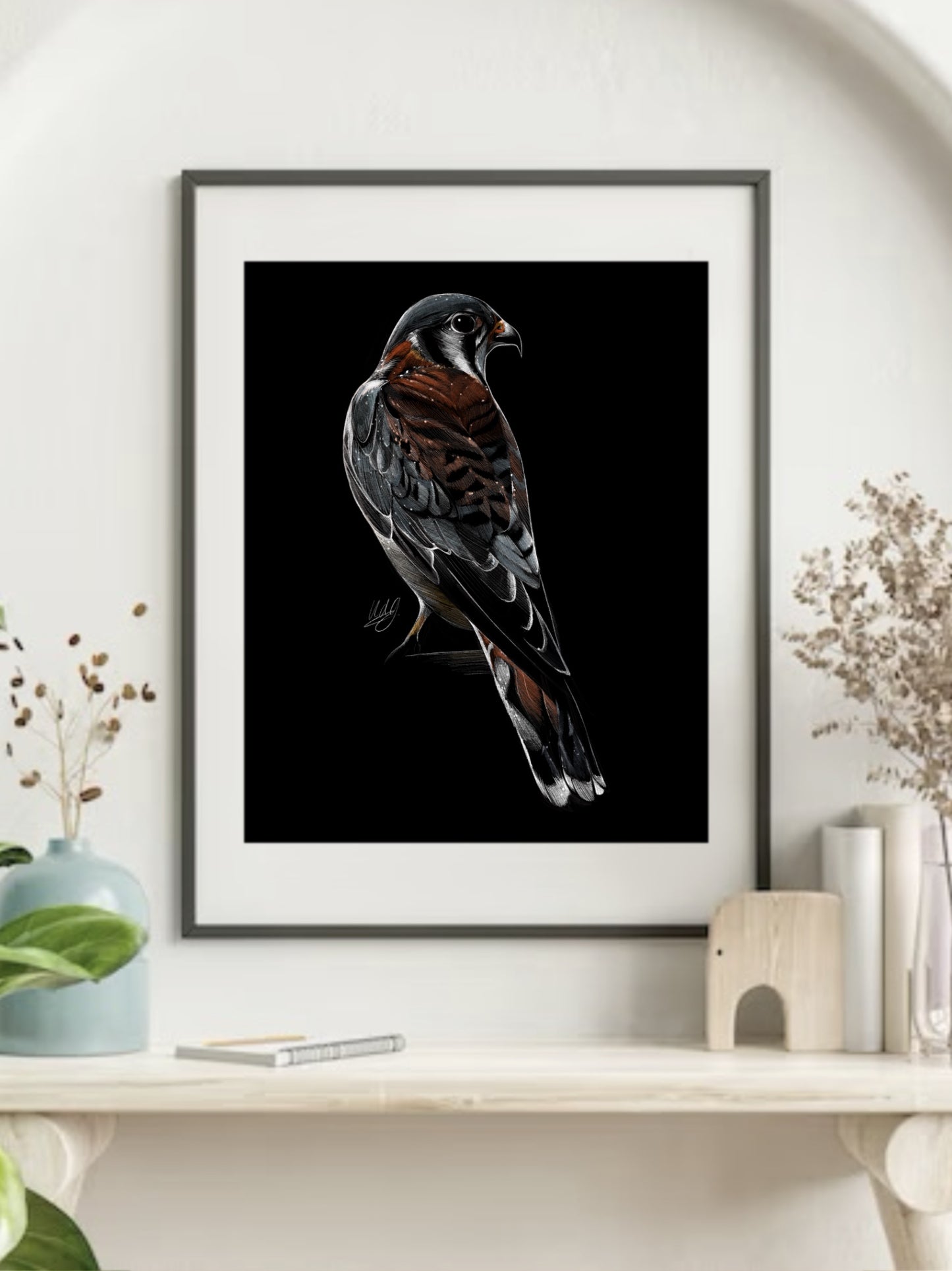 Framed Vehemence American Kestrel Art Print displayed in a stylish living space, adding a touch of vibrant nature and artistic beauty to the decor.